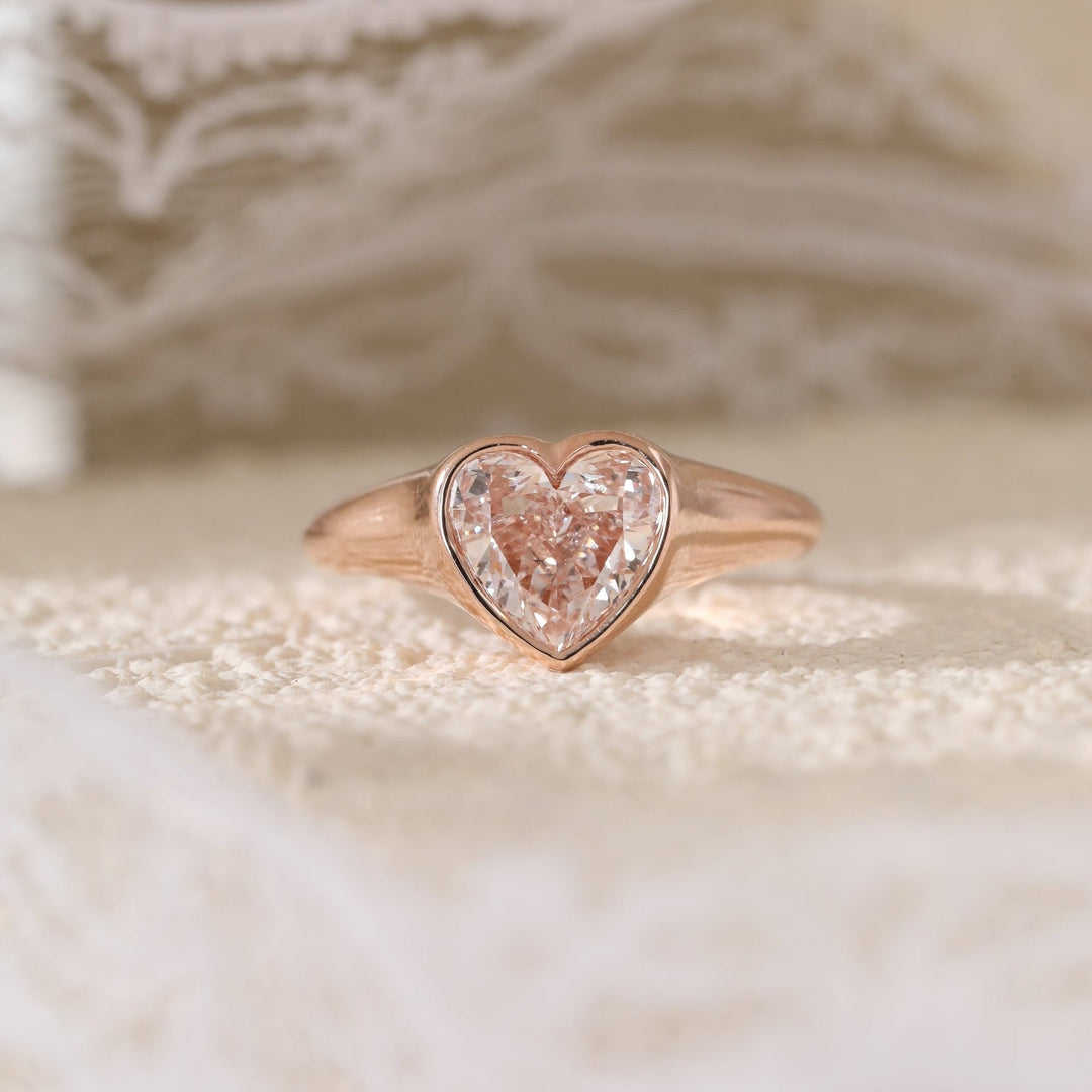 2.5ct Heart Moissanite
Unique Pink Engagement
Bezel Setting Solitaire
Romantic Bridal Jewelry
Pink Gemstone Ring
Heart Shaped Bezel
