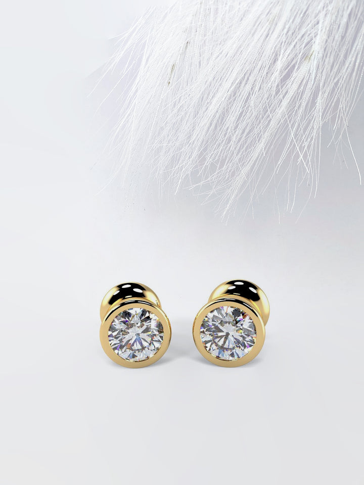 Bezel Set Round Cut Moissanite Diamond Stud Earrings in Yellow Gold