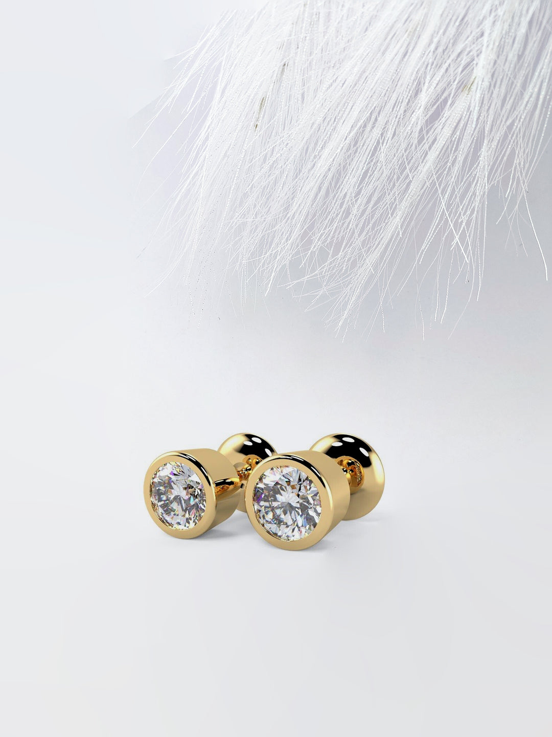 Bezel Set Round Cut Moissanite Diamond Stud Earrings in Yellow Gold