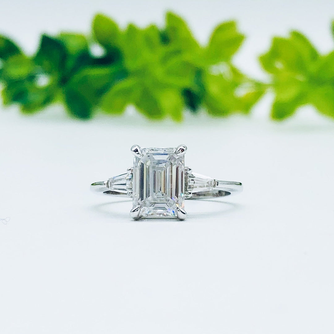 emerald-cut-three-stone-moissanite-engagement-ring