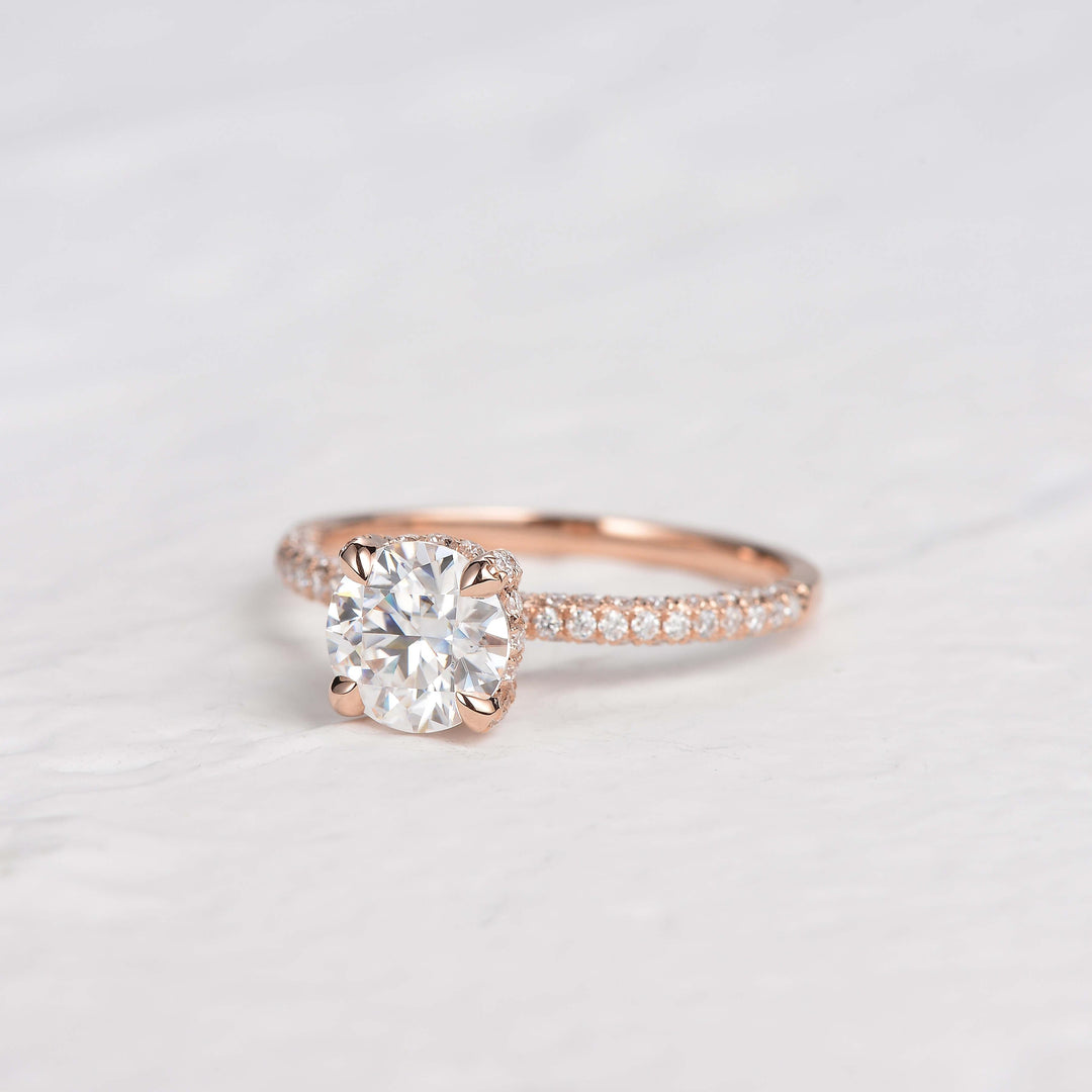 round-cut-solitaire-pave-moissanite-engagement-ring