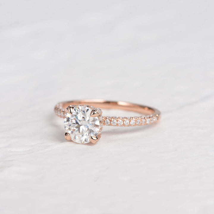 round-cut-solitaire-pave-moissanite-engagement-ring