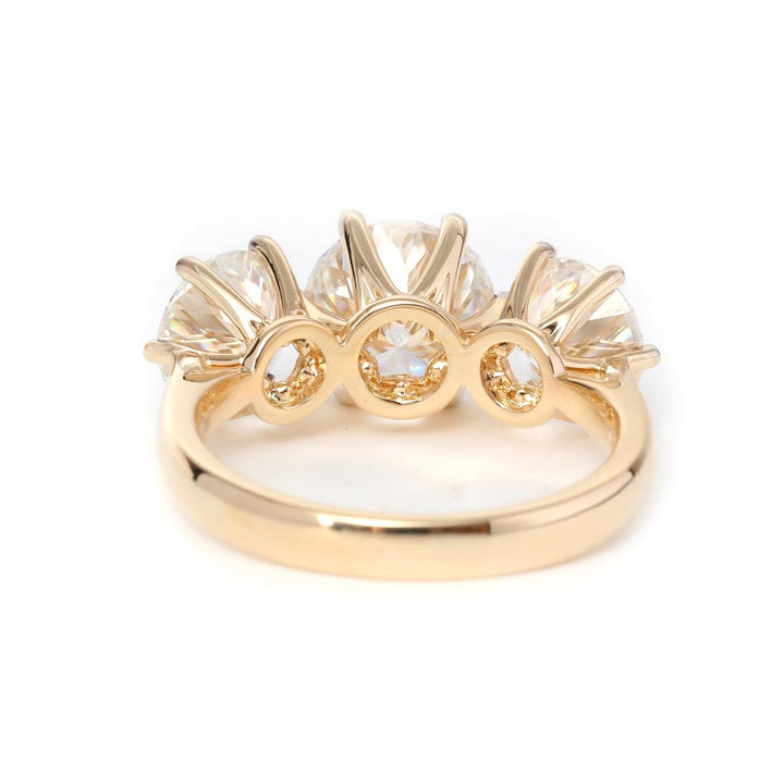 round cut diamond trilogy ring
classic three stone engagement ring
round center three stone ring