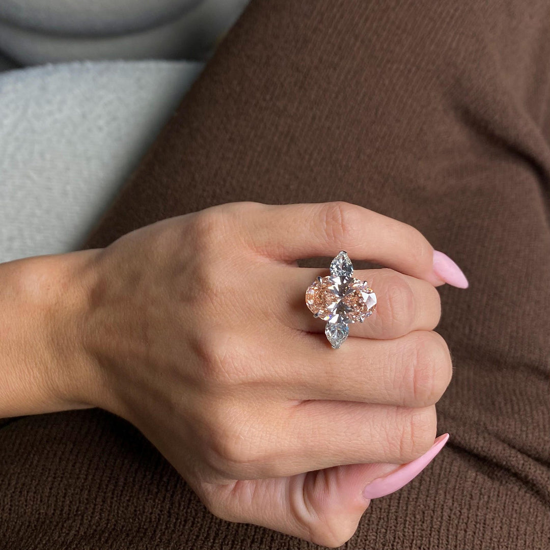 Peach Bridal Ring
Three Stone Moissanite
Sustainable Luxury
Eco Friendly Engagement
Unique Peach Ring
Modern Oval Ring

