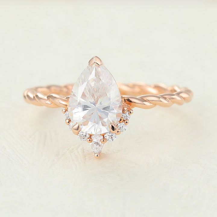 pear-shaped-moissanite-cluster-engagement-ring