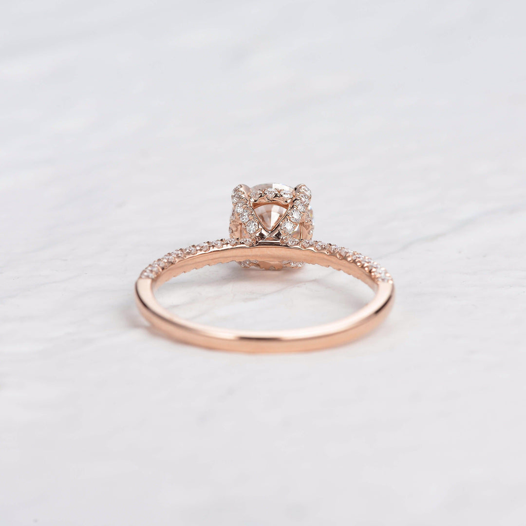 round-cut-solitaire-pave-moissanite-engagement-ring