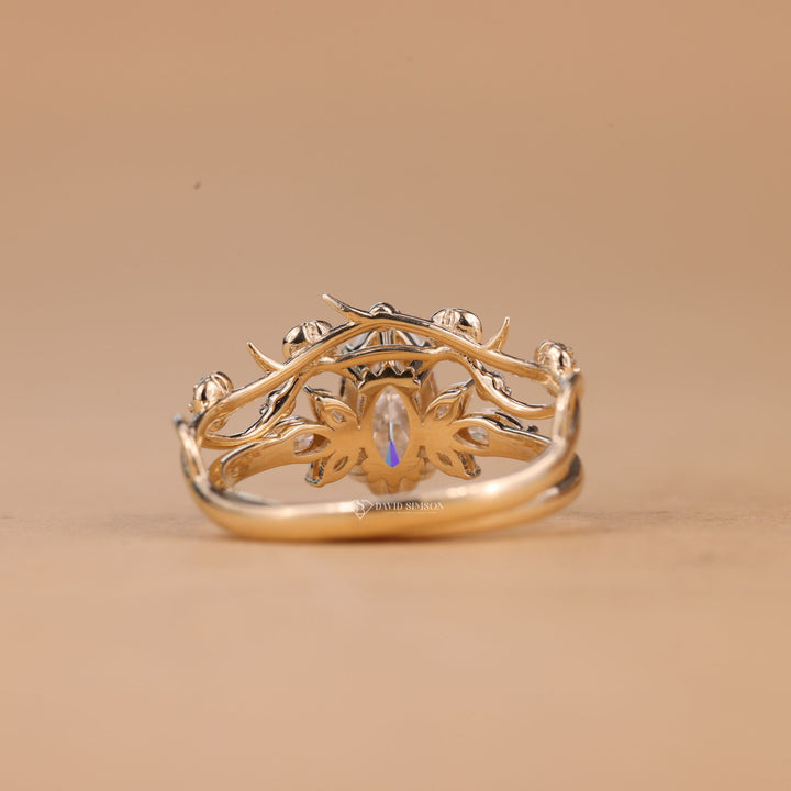 Woman wearing 2CT Marquise Cluster Engagement Ring with a unique woodsy nature-inspired band 