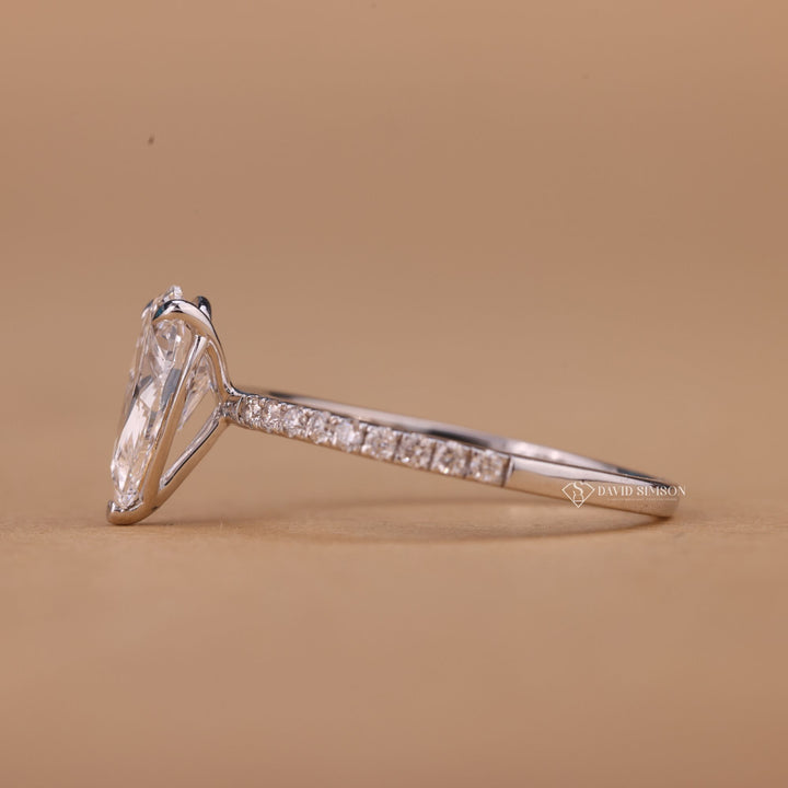2 Carat Pear Moissanite
Thin Pave Band Ring
Crushed Ice Pear Moissanite
