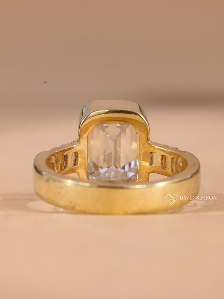 DEF colorless moissanite
GRA certified moissanite
14k gold emerald ring
18k white gold bezel