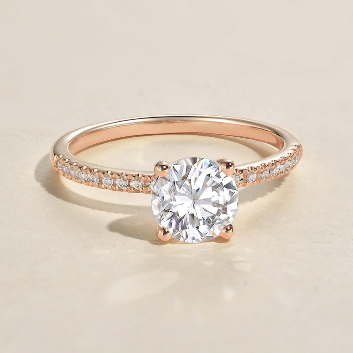 round-cut-solitaire-pave-moissanite-engagement-ring