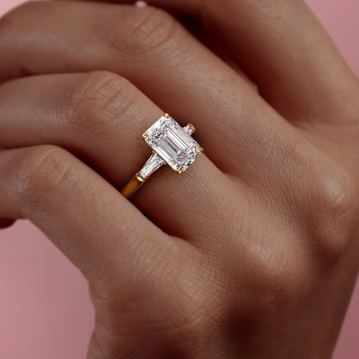 emerald-cut-three-stone-moissanite-engagement-ring