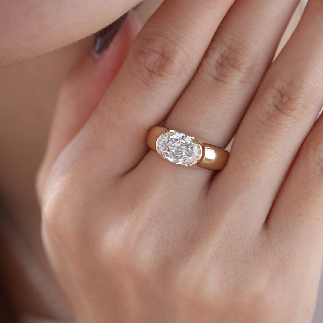 Step Cut Oval Moissanite
Half Bezel Engagement Ring
East West Oval Ring
3 Carat Moissanite
