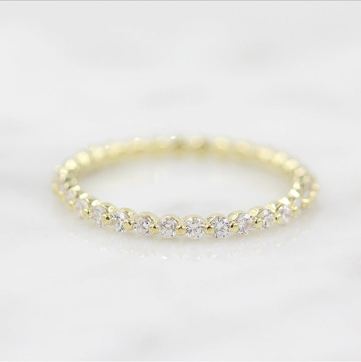 round-cut-half-eternity-moissanite-wedding-band