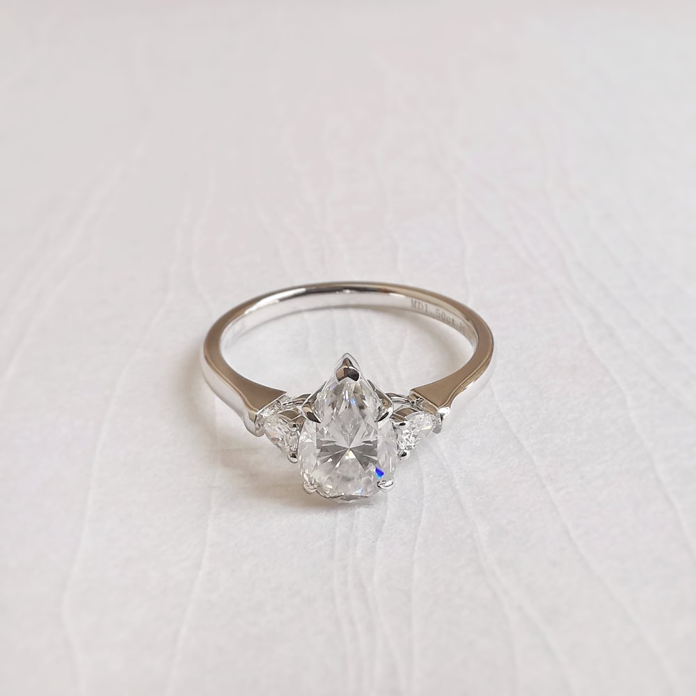 1-50-ct-pear-shaped-moissanite-three-stone-engagement-ring