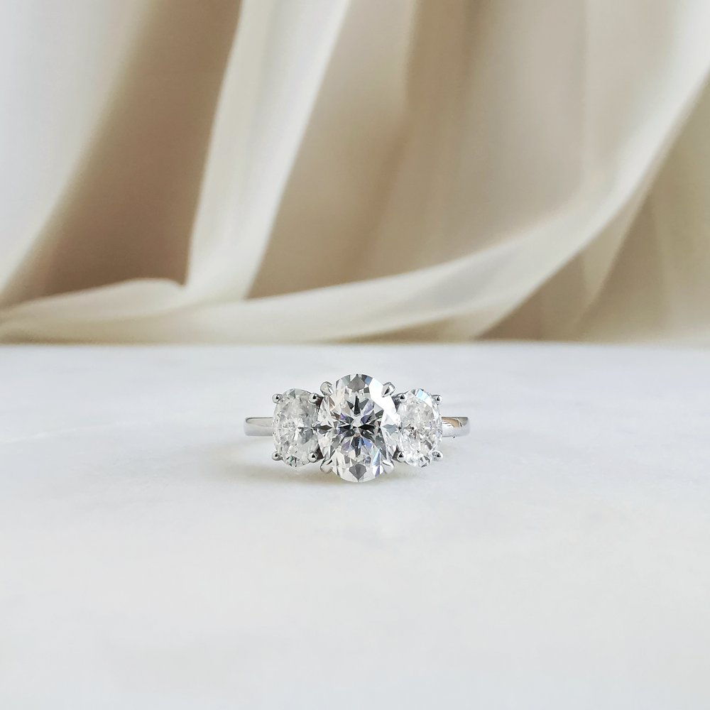 1-50-ct-oval-shaped-moissanite-three-stone-engagement-ring