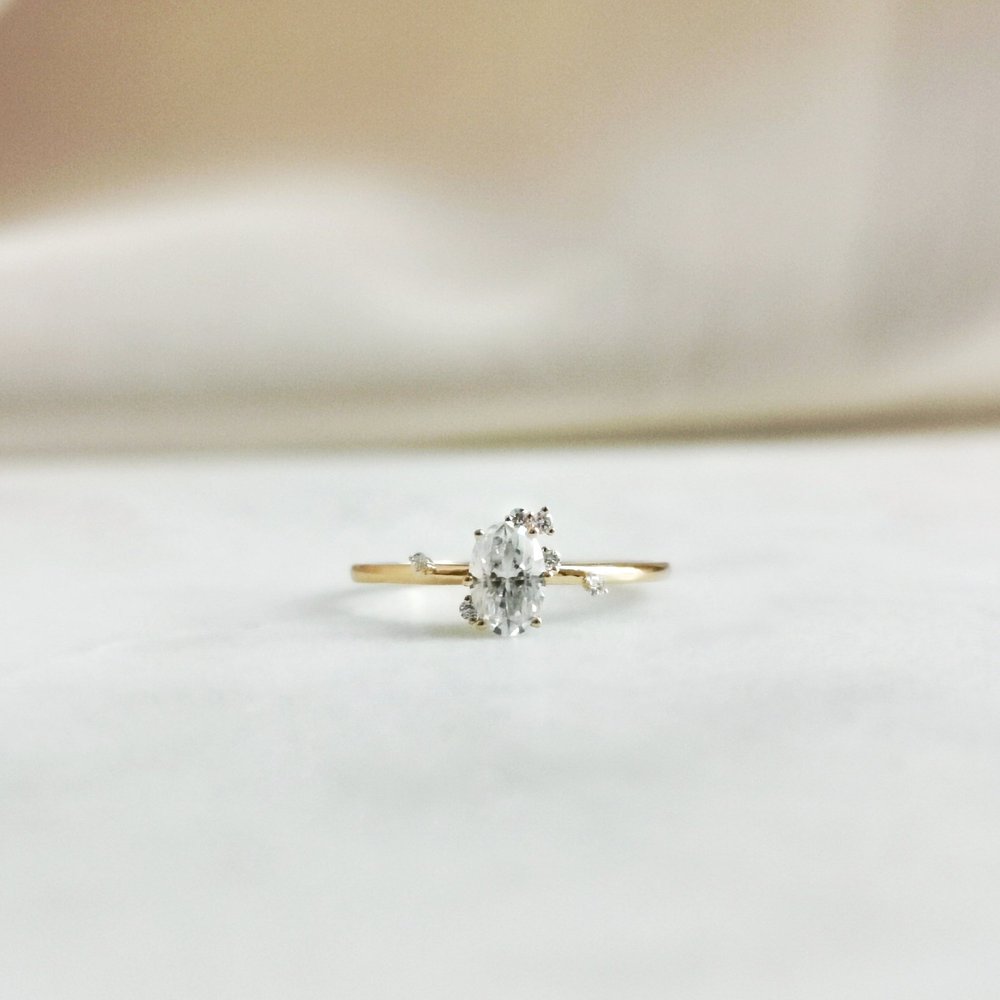 0-50-ct-oval-shaped-moissanite-cluster-engagement-ring