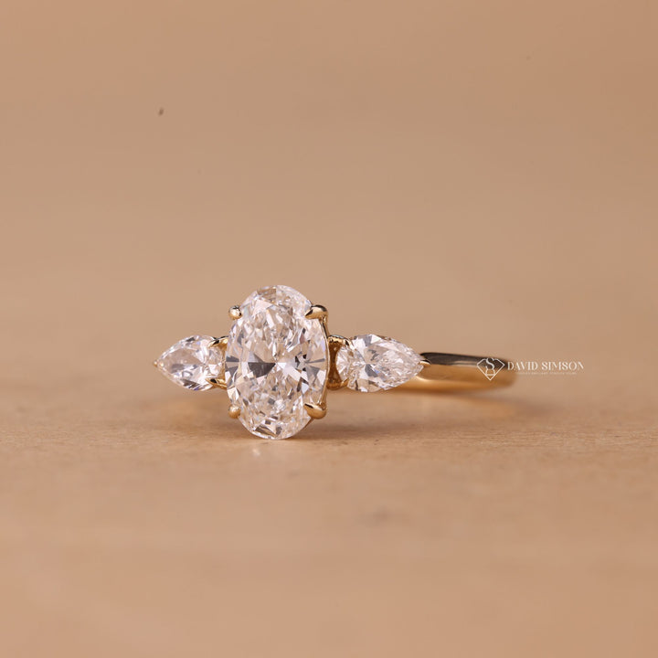 Round Side Stone Ring
Modern Three Stone Ring
Anniversary Oval Ring
