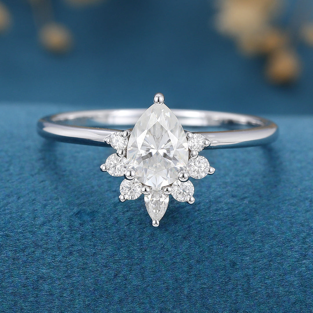 0-69-ct-pear-shaped-moissanite-cluster-engagement-ring-2