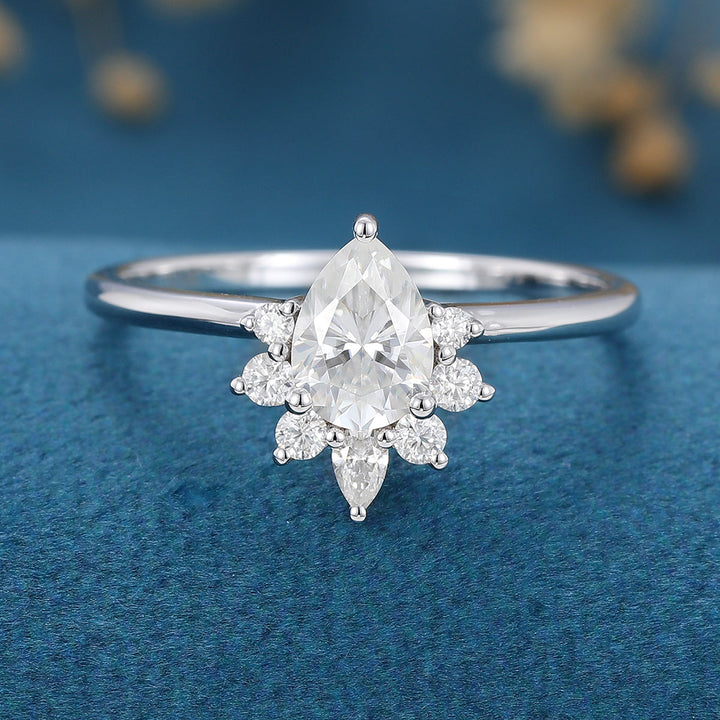 0-69-ct-pear-shaped-moissanite-cluster-engagement-ring-2