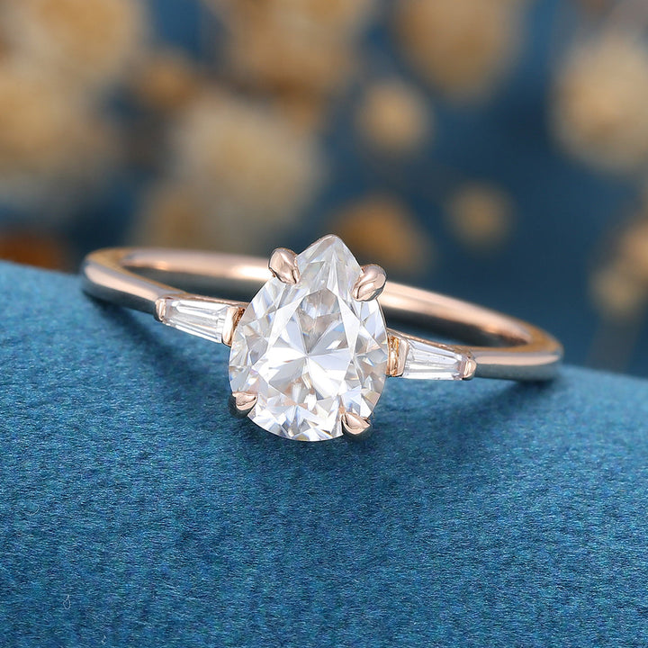 pear-shaped-moissanite-three-stones-engagement-ring