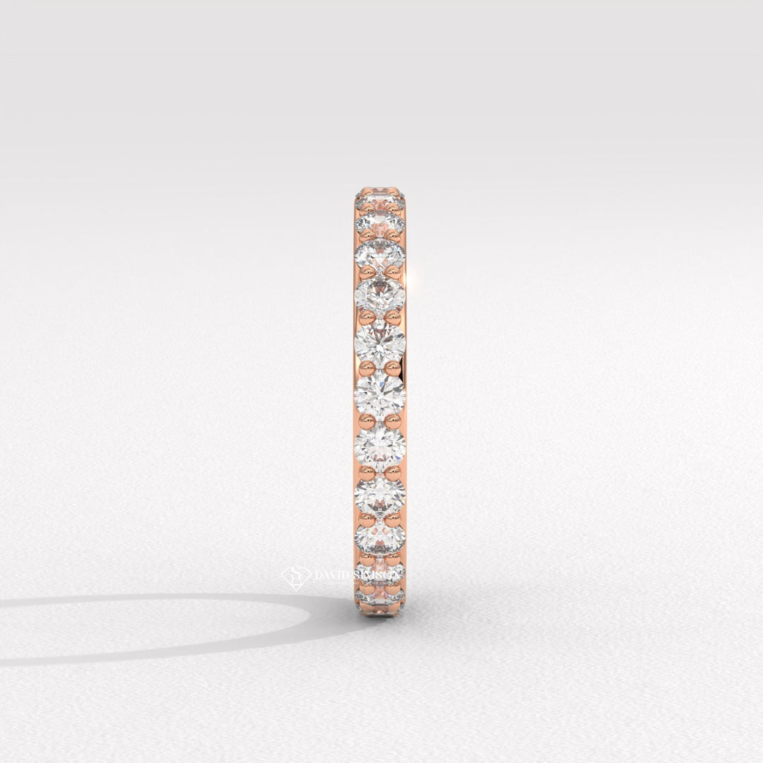 Colorless Moissanite
Brilliant Cut
Prong Set Ring
Pave Eternity Band