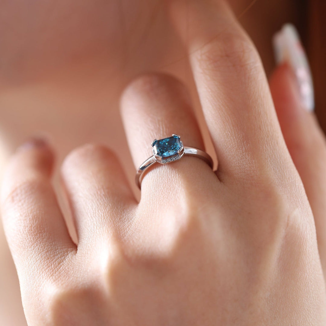 Starlit Ocean Ring
Fancy Color Diamond Ring
Blue Radiant Solitaire
Teal Blue Diamond
Unique Blue Engagement Ring
Sustainable Blue Diamond
Ethical Bridal Jewelry
