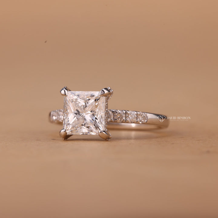 Solid gold bridal ring
GRA certified moissanite
Princess solitaire pave