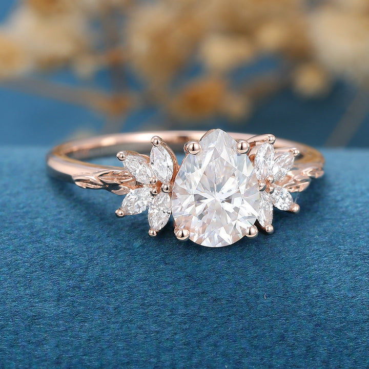 1-0-ct-pear-shape-moissanite-cluster-engagement-ring