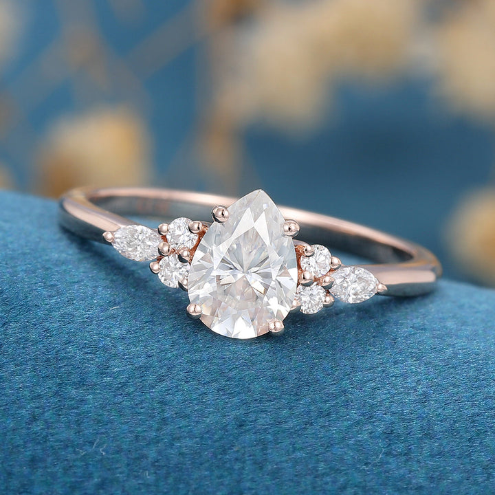 1-0-ct-pear-shaped-moissanite-cluster-engagement-ring-19