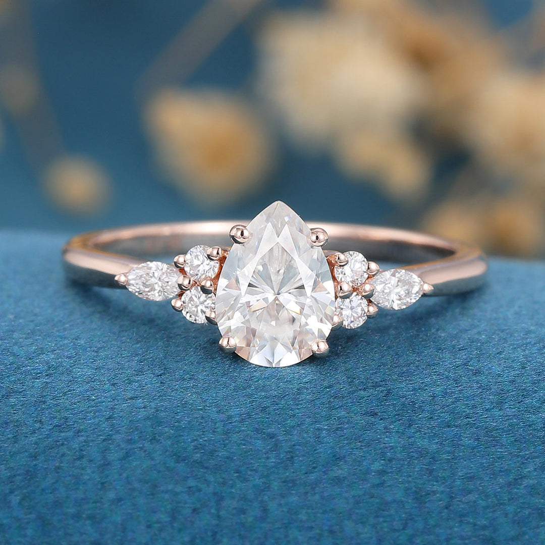 1-0-ct-pear-shaped-moissanite-cluster-engagement-ring-17