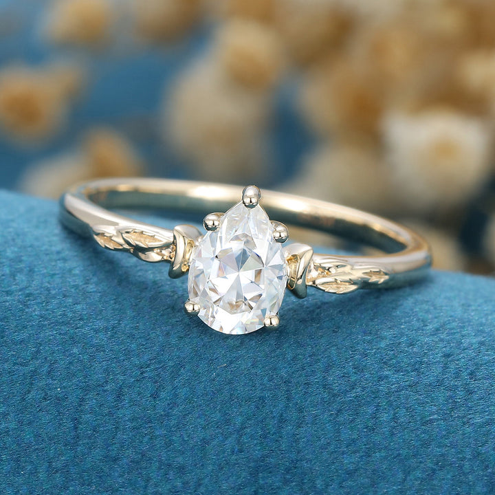 0-69-ct-pear-shaped-moissanite-vintage-solitaire-engagement-ring