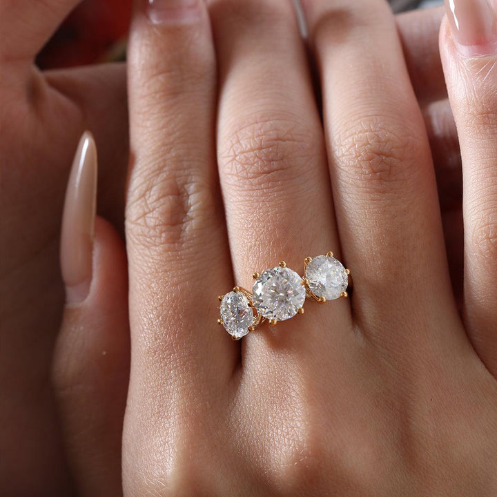 multi-faceted diamond, cathedral setting, side stone engagement ring, unique round diamond, 1.5ct three stone ring, 2ct three stone ring, 2.5ct three stone ring, hand-cut diamond, 