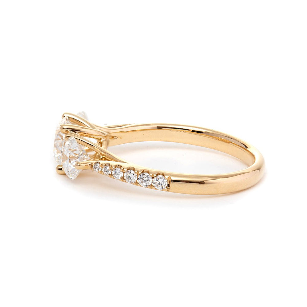 round diamond ring
three stone ring
pavé engagement ring
diamond engagement ring
round cut diamond
three stone engagement ring