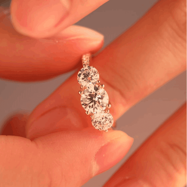 round diamond ring
three stone ring
pavé engagement ring
diamond engagement ring
round cut diamond
three stone engagement ring