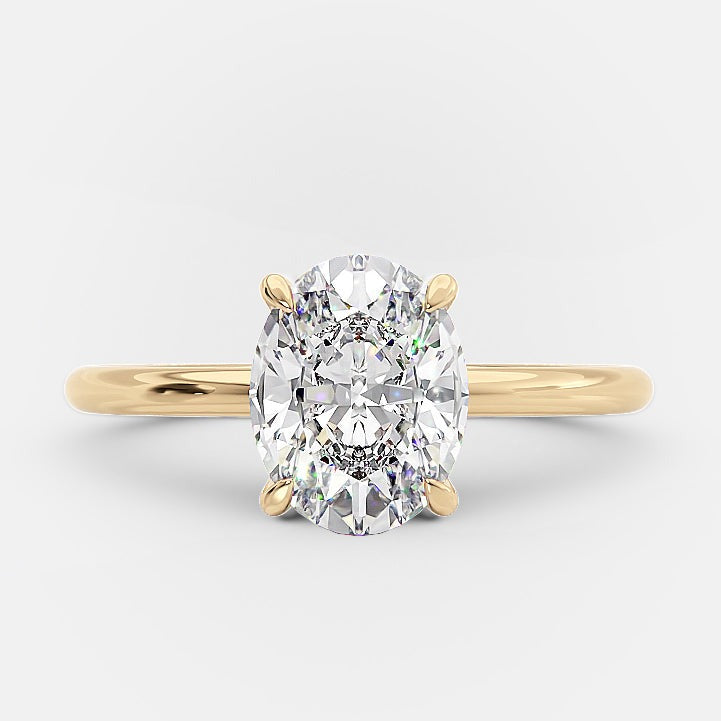 Detailed setting on this moissanite ring, in 14k yellow gold