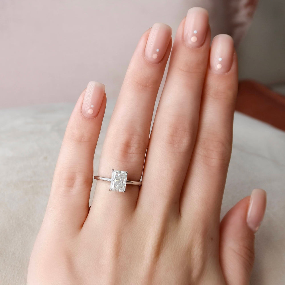 Moissanite ring in 18k rose gold, a halo engagement ring